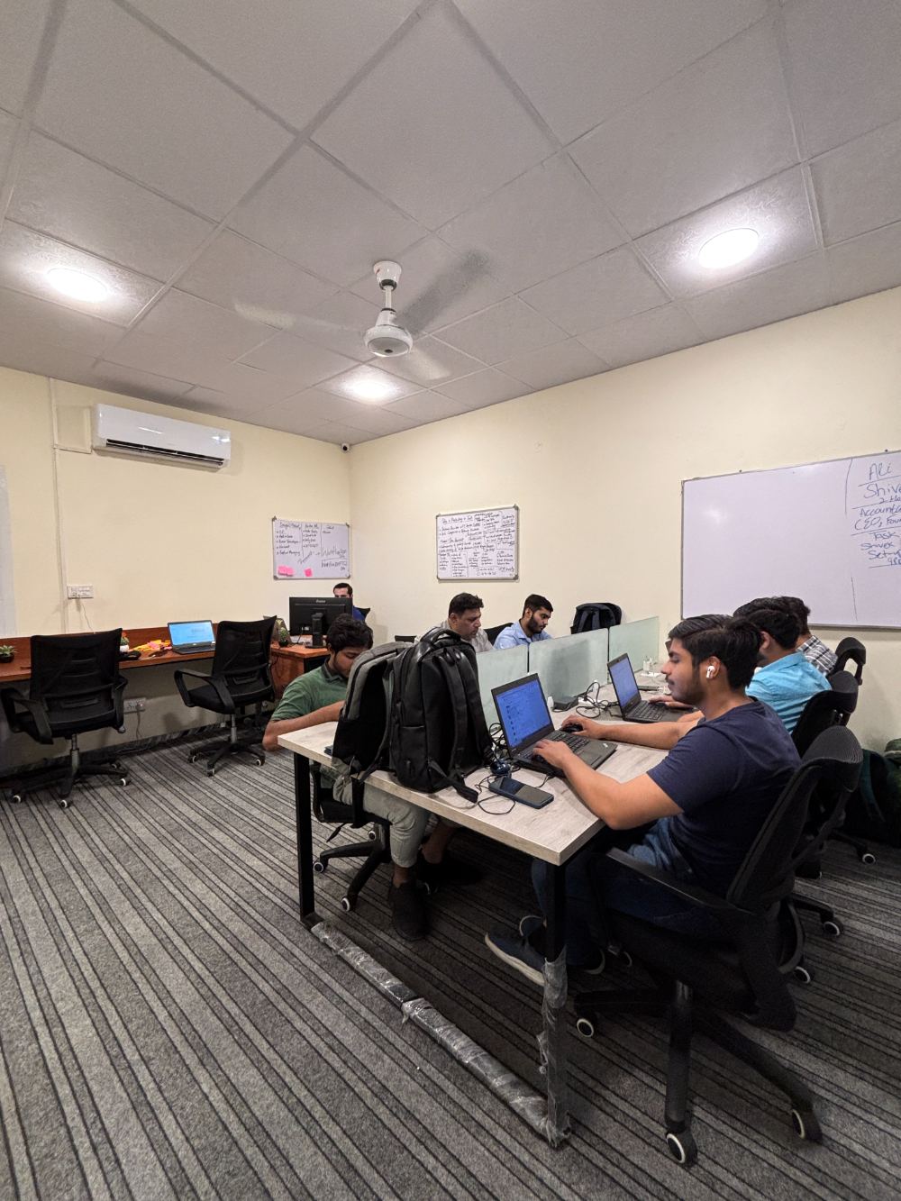 Coworking desks with divider screens at WorkHive