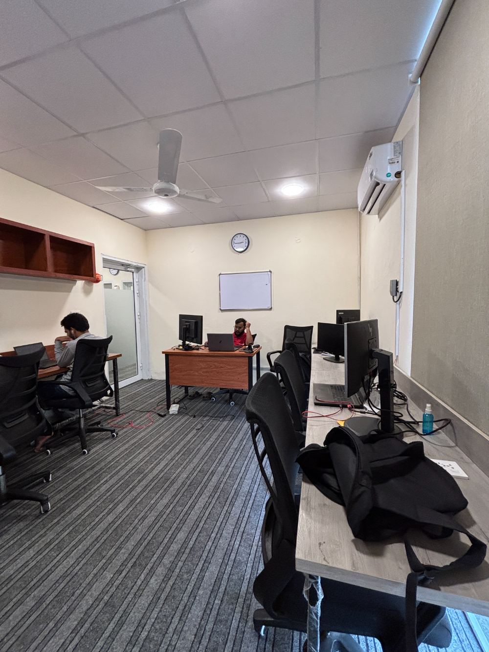 Dedicated desks with monitors at WorkHive
